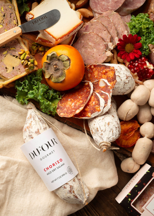 Dufour Gourmet chorizo dry salami on a charcuterie board with cured meats and cheese