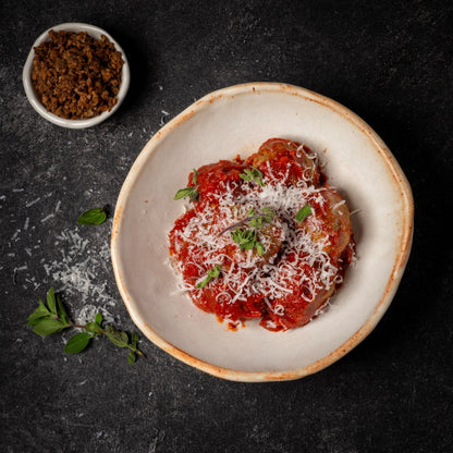 50CUT meatballs in tomato sauce topped with grated cheese