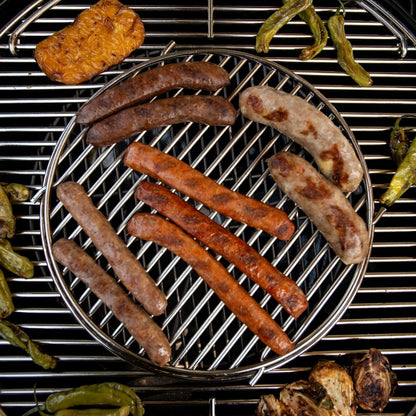 BBQ master grilling sampler with assorted sausages cooking on a grill